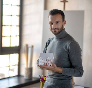 handsome-young-man-enjoying-his-work-as-interior-d.jpg
